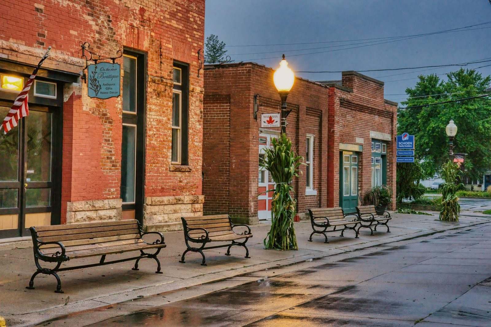 Brick storefronts and benches along historic downtown Wabasha, Minnesota, one of the small Central-time markets in a regional text program