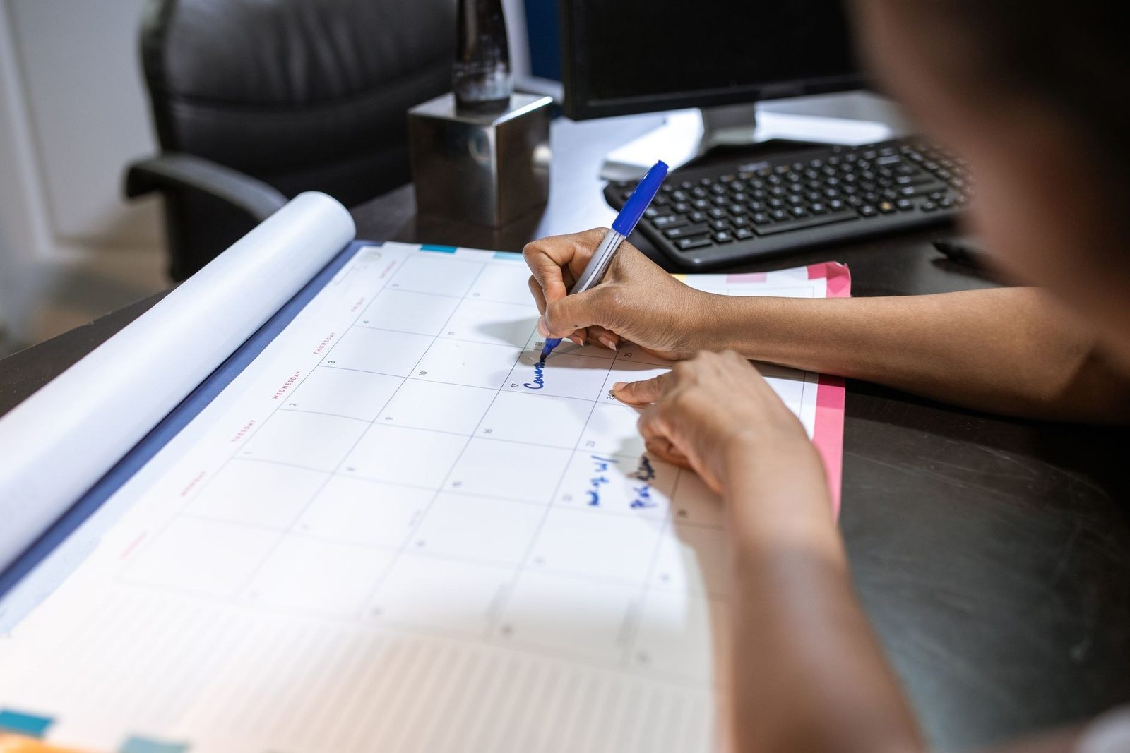 Open annual planner notebook, the kind of long-view schedule SMS automation runs on