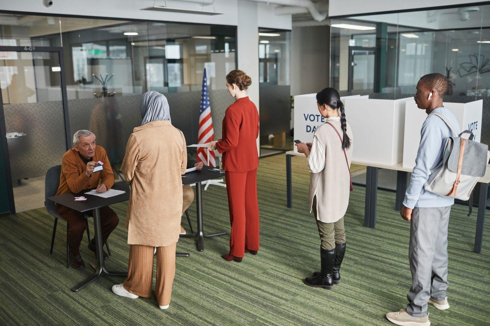 Voters waiting at a polling station, the local electorate a candidate works to reach